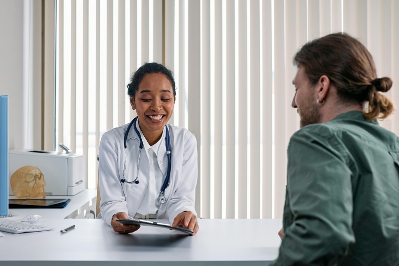 Doctor using an EMR system to streamline patient documentation and reduce paperwork
